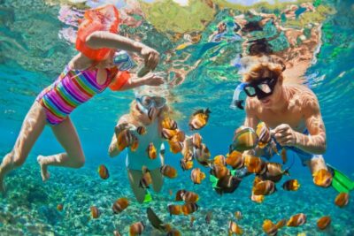 underwater photo happy family snorkelling in tropical sea