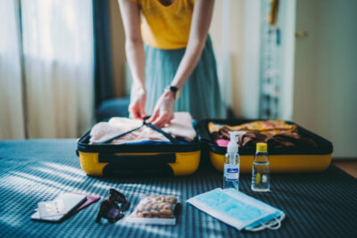 A woman packing her suitcase during the pandemic