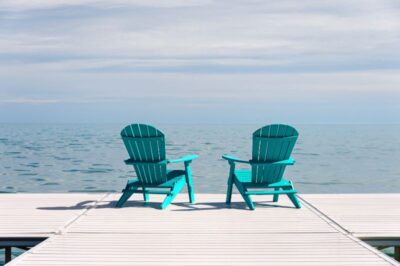 Two wooden chair on the dock