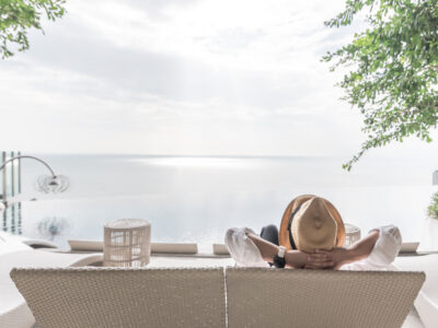 Man relaxing on beach front veranda