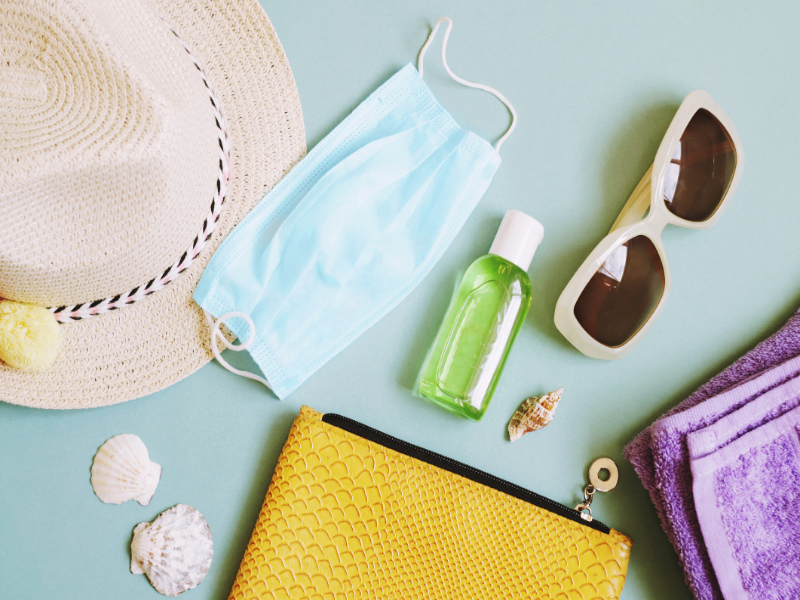 Beach travel essentials flatlay